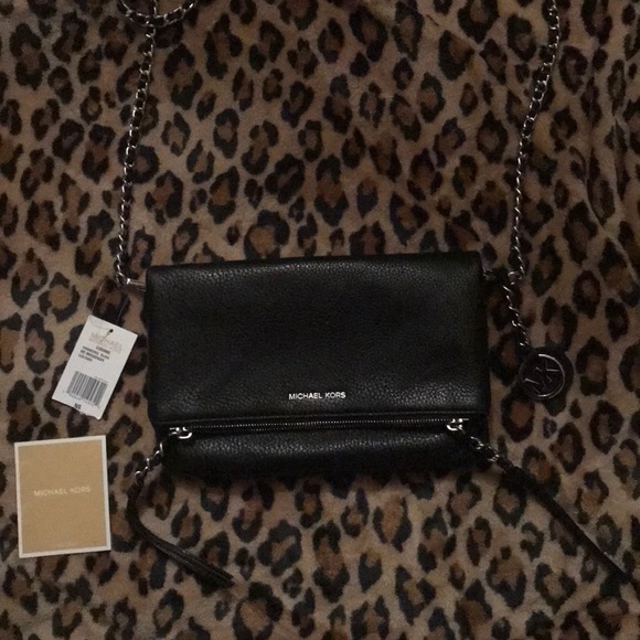 Michael Kors Handbags - SALE NWT Micheal kors soft leather clutch